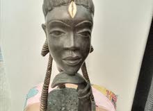 Pretty black girl's head sculpted in ironwood by an anonymous artist from the 1950s.