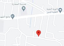 قطعة أرض 200 حمدان جامع الشهيد طه قريبه للشارع العام ركن ع شارعين