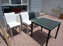 10 colored outdoor chairs and 1 table