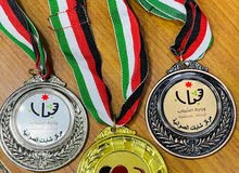ميداليات دروع وكروت وكتب هاردكفر مطوية ودفاتر سندات