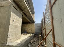 بناية نظام قاعات خلف مستشفى اليرموك