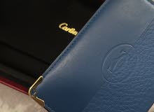 cartier cardholder blue used and clean with box and bag