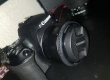 كاميرا كانون 200D اخت الجديدة مع عدسة اساسة وعدسة 50mm مع اضائة