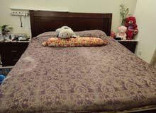 King-size bed frame and mattress including two side tables for sale