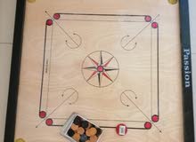 carrom board with coin & striker