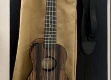 Ukulele with strap