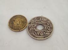 deux pièces monnaies  France/Tunisie.