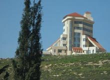 ارض للبيع في رجم عميش - مساحات مختلفة - بجانب فندق افرست