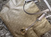 mickel korse gold hand bag in very good condotion mickel korse gold hand bag in very good condotion