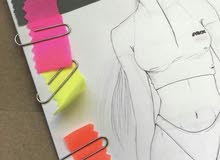 Drawing new fashion designs Drawing new fashion designs