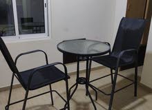 table with two high chairs for sale