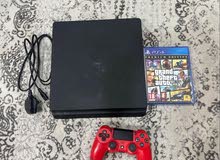 PS4 slim 500 GB with grand premium edition and a controller.