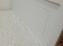 A bed with a mattress A bed with a mattress
