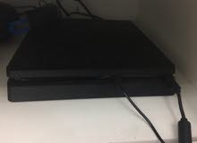 SONY PLAYSTATION 4 SLIM 1TB WITH GAMES AND 2CONTROLLERS.