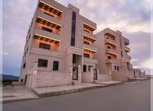 شقة بمساحة 125م طابق أول في الزرقاء الجديدة جبل المغير للبيع شقة - تشطيبات راقية جدًا (فلل)