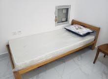 wooden bed with accessories