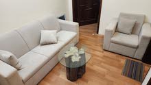 4 seater sofa set with round glass table.