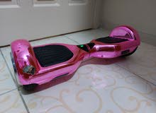 Hoverboard with unique pinkish color which changes shade Hoverboard with unique pinkish color which changes shade