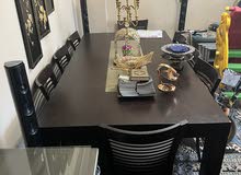 Dining table with 8 chairs, 30 KD.                  طاولة سفرة 8 كراسي 30 دينار