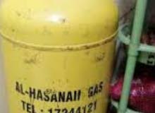 alhassanan gas cylinder with regulator and pipe half gas in cylinder