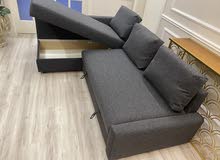 L shaped sofa come bed with storage.