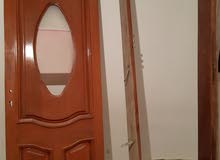 باب خشبي بالقفص باب خشبي بالقفص