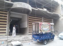بناية تجارية هيكل للبيع كرادة داخل مقابل مستشفى عبد المجيد بسعر مغري
