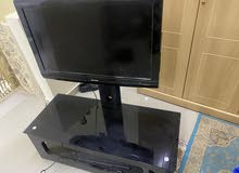 Sharp tv with table for sale
