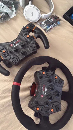 Asetek invicta wheelbase with pedals and steering wheel