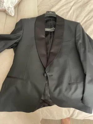 Black tuxedo with white tuxedo jacket and two shirts and waist band and two bow tie (red and black)