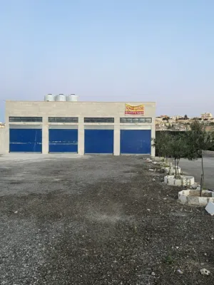 مستودعان متجاوران بمساحة إجمالية 100متر – واجهة حجر وموقع مميز في الهاشمية