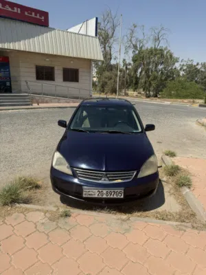 لانسر 2013 حاله ممتازه جدااا دفتر سنه