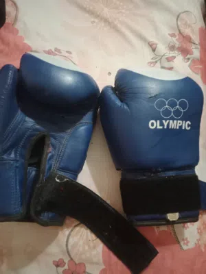 قفازات ملاكمه وشنكارات رياضه التايكوندو والجودو ماركه اوليمبك باكستاني