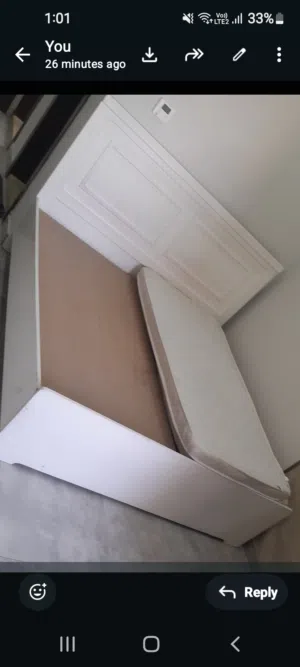 wooden bed without mattress