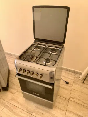 For sale: stove, automatic washing machine, bed, and refrigerator.