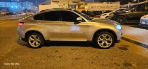 سيارة بي ام دبليو الفئة X6 2011 موديل فضي بحالة ممتازة شرط الفحص. أو تبديل مع دينالي 2013 - 2014