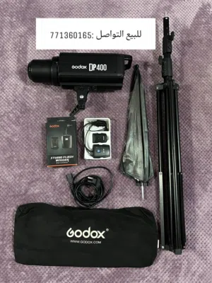(فلاش جودكسDP400&مظله مع ستاند و وترايجر و شنطه) (سوفت بوكس كبير و صغير&حلقات تثبيت بخمسة أضواء)
