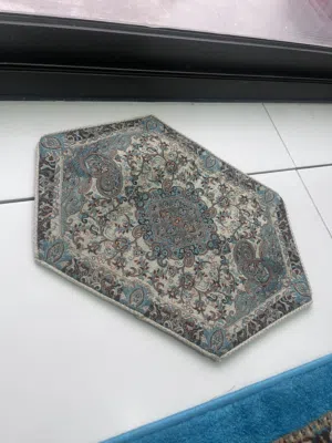 Persian Termeh table cover or runner featuring intricate paisley designs. المنتج هو تيرمه (Termeh)،