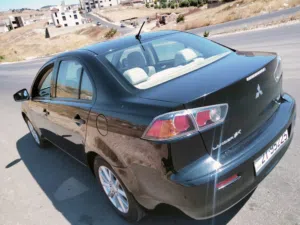 متسوبيشي لانسر موديل 2015 مستخدم فقط من الزيرو  ممشى قليل جدا 109 الاف كيلو فقط  فحص كامل 7 جيد