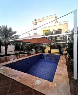 فيلا سكنية ممتازة في تاجوراء وبها حوض سباحة حديثة البناء دورين نظام خليجي روعه في التشطيب والحي سكني