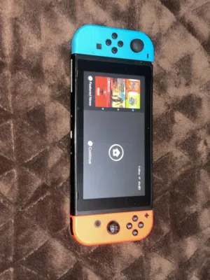 Nintendo switch red and blue and dock with two games and all accessories and extra 32gb of storage