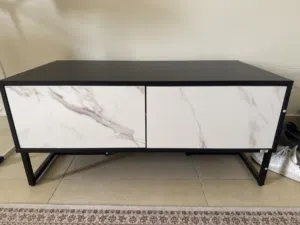 A white and black Tv Unit with drawers