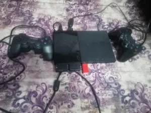 بلايستيشن 2 بحاله الوكاله مع العابها و معدله