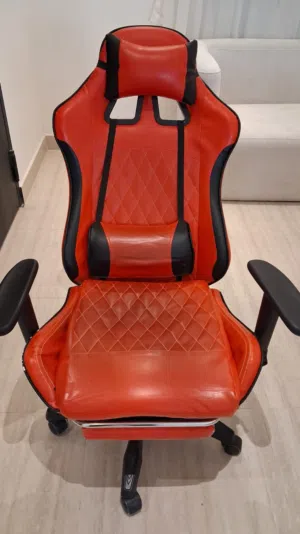 red ergonomic racing gaming chair with retractable footrest with minor scratches selling at sar150.
