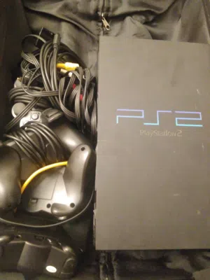 Ps2 console with wires and controllers