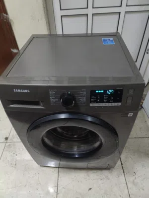 samsung latest model fully automatic washing machine in new condition very less used neat and clean