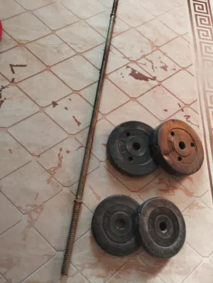 بار حديد + اوزان 15 كيلو ................ . . . . . . .