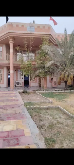 بيت مساحته 503م واحهته اكثر من 13على الشارع العام تجاري في محافظة بابل سياحي قرية الدولاب.