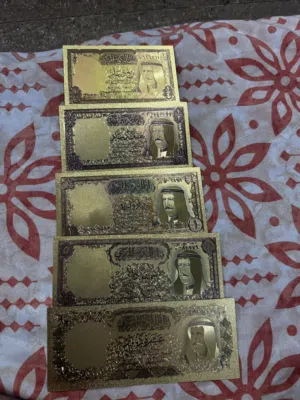 This is a commemorative gold-plated banknote featuring a portrait of King Sabah Al-Salim Al-Sabah.