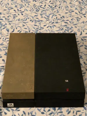 Playstation 4 for sale with a controller and two games